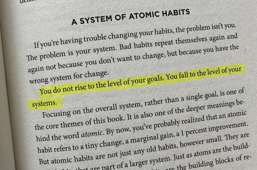 An image of a book page from Atomic Habits with a line highlighted.