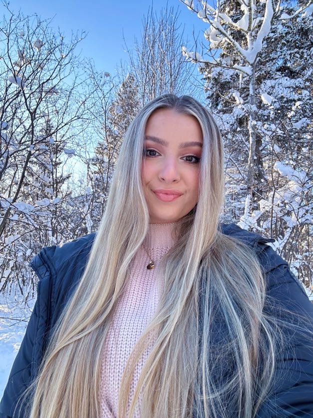 Me in front of snowy winter background- to show my hair.