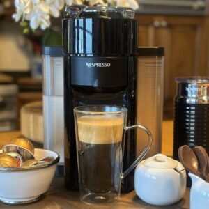 Nespresso Vertuo Review Cover Image of the coffee machine sitting on the counter.