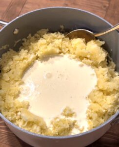 Adding the Cream Cheese Mixture to the Potatoes