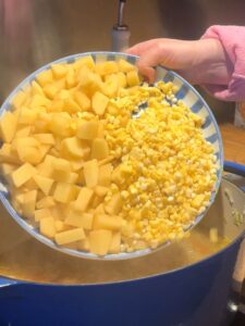 Adding the Potatoes and Corn