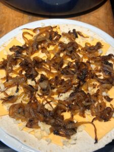 Prepping the Other Tortilla With Cheese and Onions