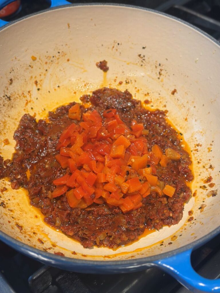 Adding the roasted red peppers