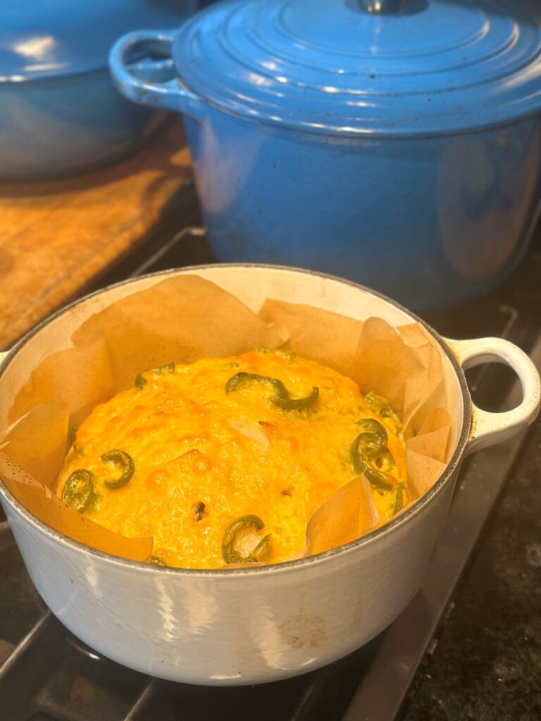Jalapeno Cheddar Bread in Dutch Oven Right Out of the Oven Sitting on Stove