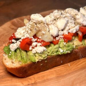 Mediterranean Avocado Toast with Feta, Roasted Red Peppers, & Artichokes Recipe---A Close Up of the Toast