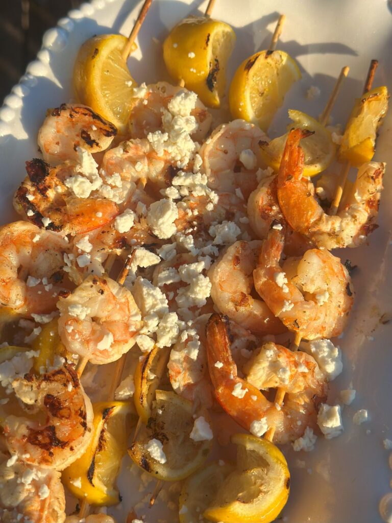 Easy Grilled Shrimp Skewers With Lemon and Feta on a Platter