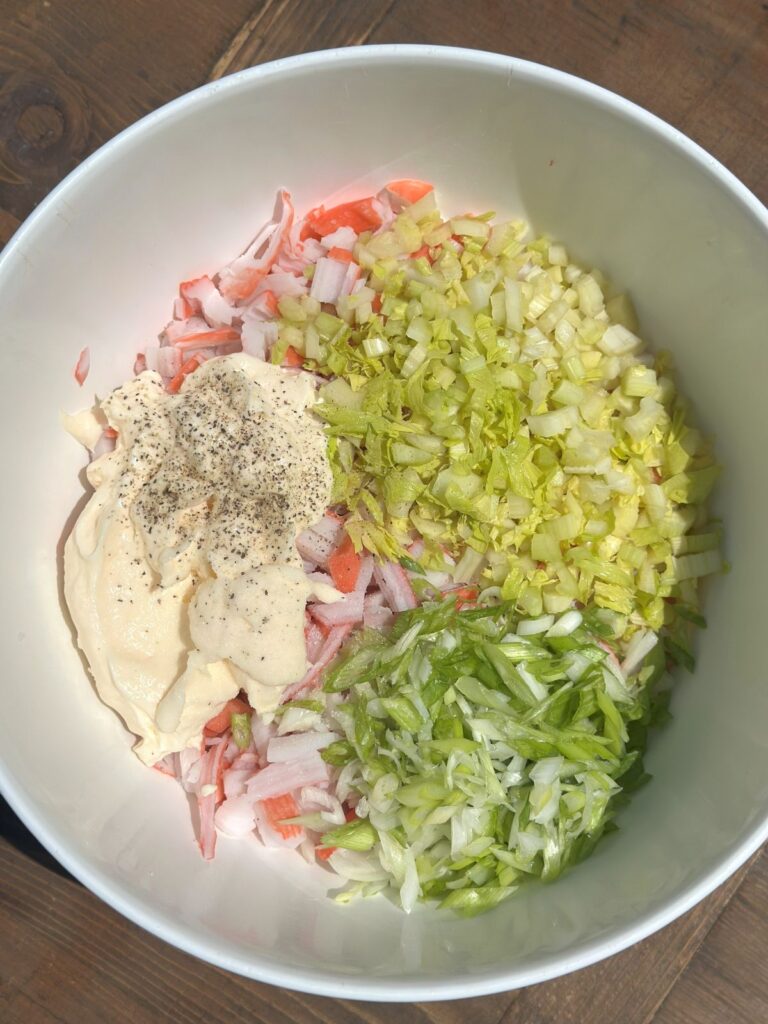 All of the Crab Salad Ingredients in a Mixing Bowl