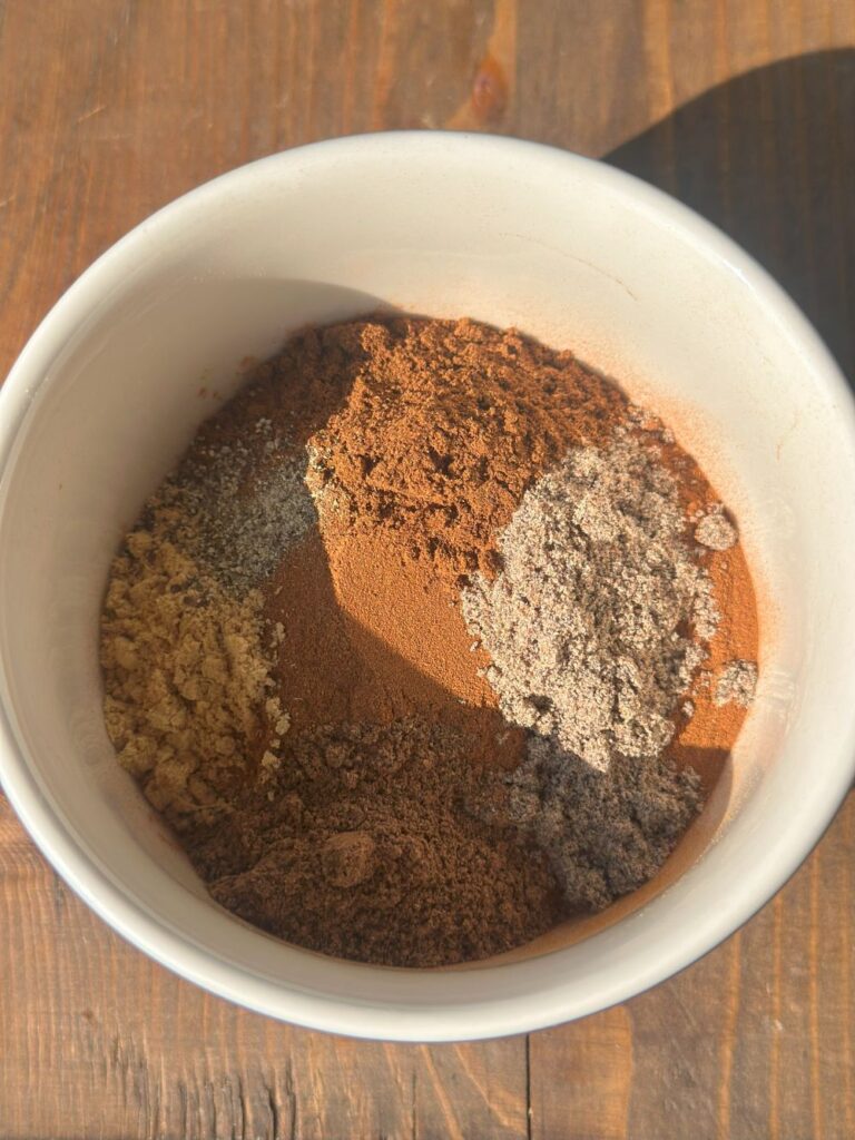 All the Chai Spice Ingredients in a Small Bowl