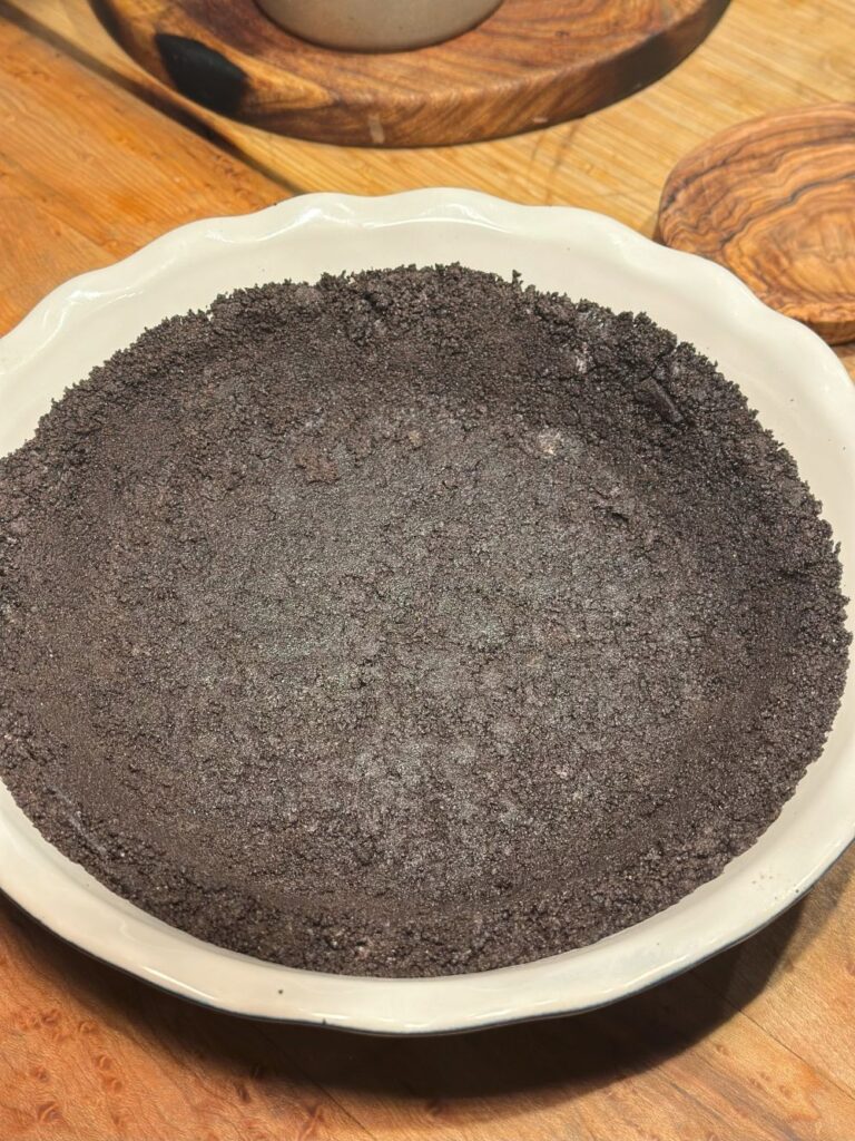 Oreo Crust Patted Into Pie Dish for Peanut Butter Pie