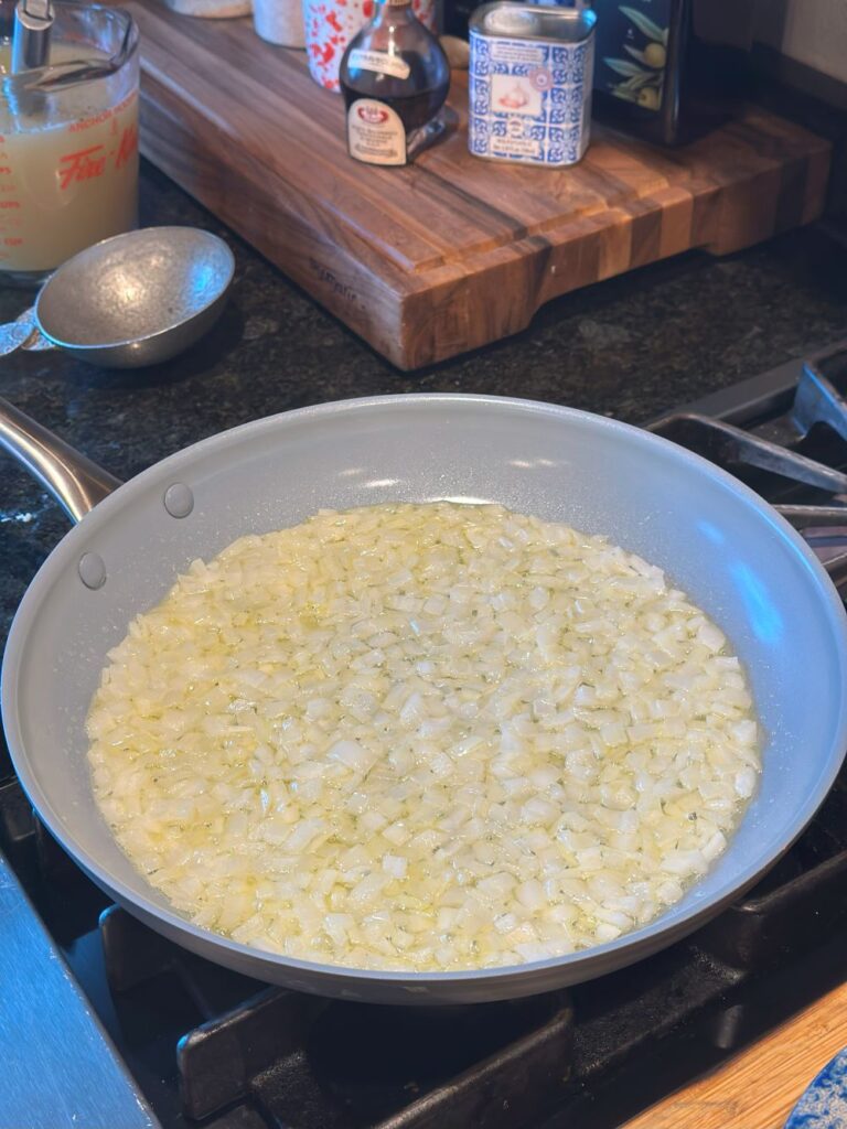 Sauteing the onions in butter.