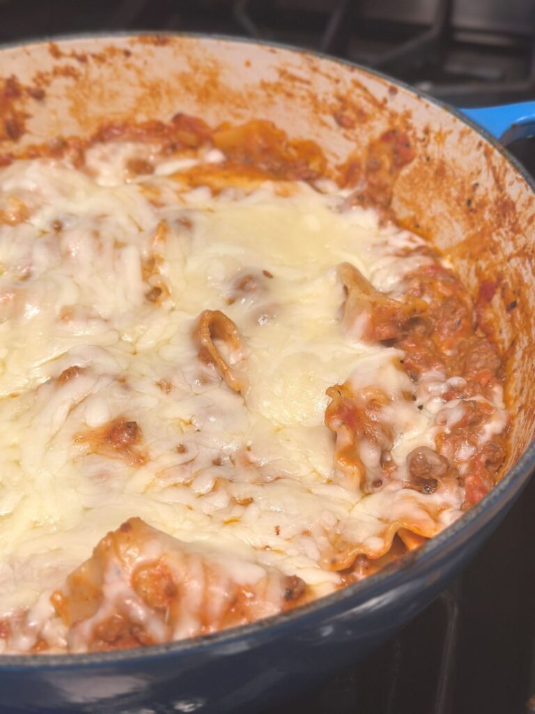 A close up of a large pot holding an easy cheesy stovetop lasagna dish.